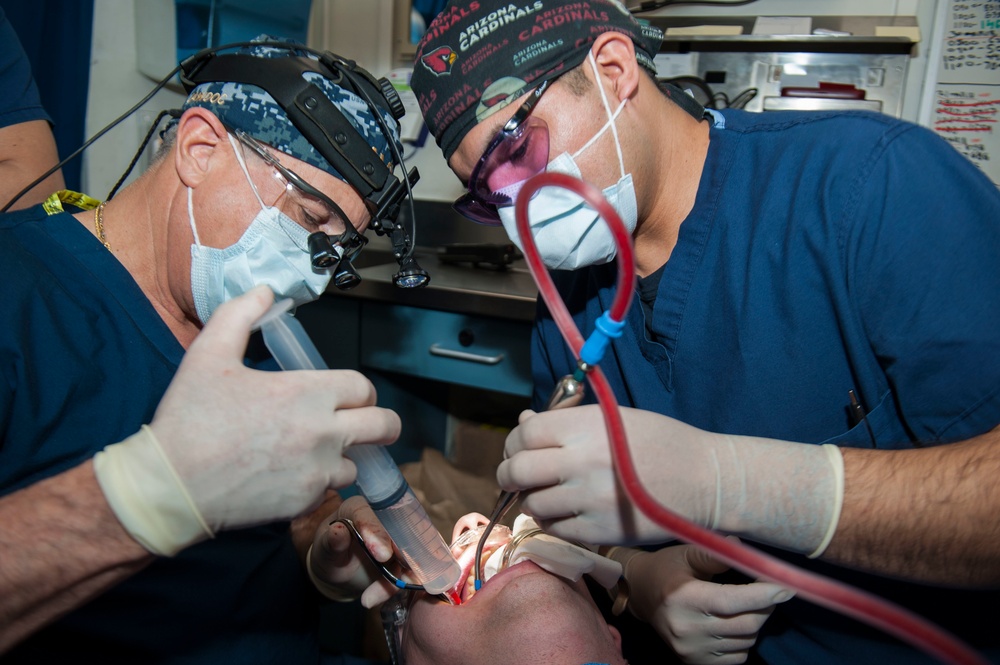 GHWB Dental Officer Performs Oral Surgery