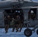Recon Marines fast rope from an MH-60S aboard the USS Wasp