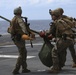 Recon Marines fast rope from an MH-60S aboard the USS Wasp