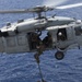 Recon Marines fast rope from an MH-60S aboard the USS Wasp