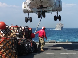 Camp Lemonnier Sailors work onboard a USNS vessel