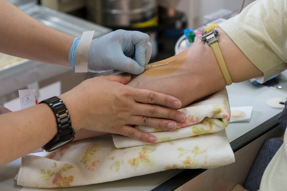Members of Team Yokota donate blood to JRCS