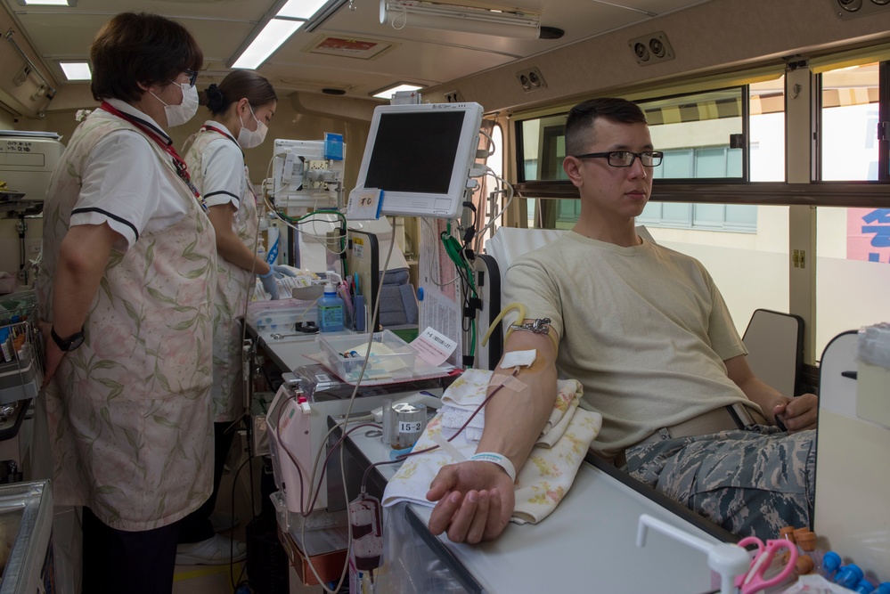 Members of Team Yokota donate blood to JRCS
