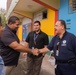 Luis Roberto Clemente is Greeted by FEMA Staff At Event In Lares