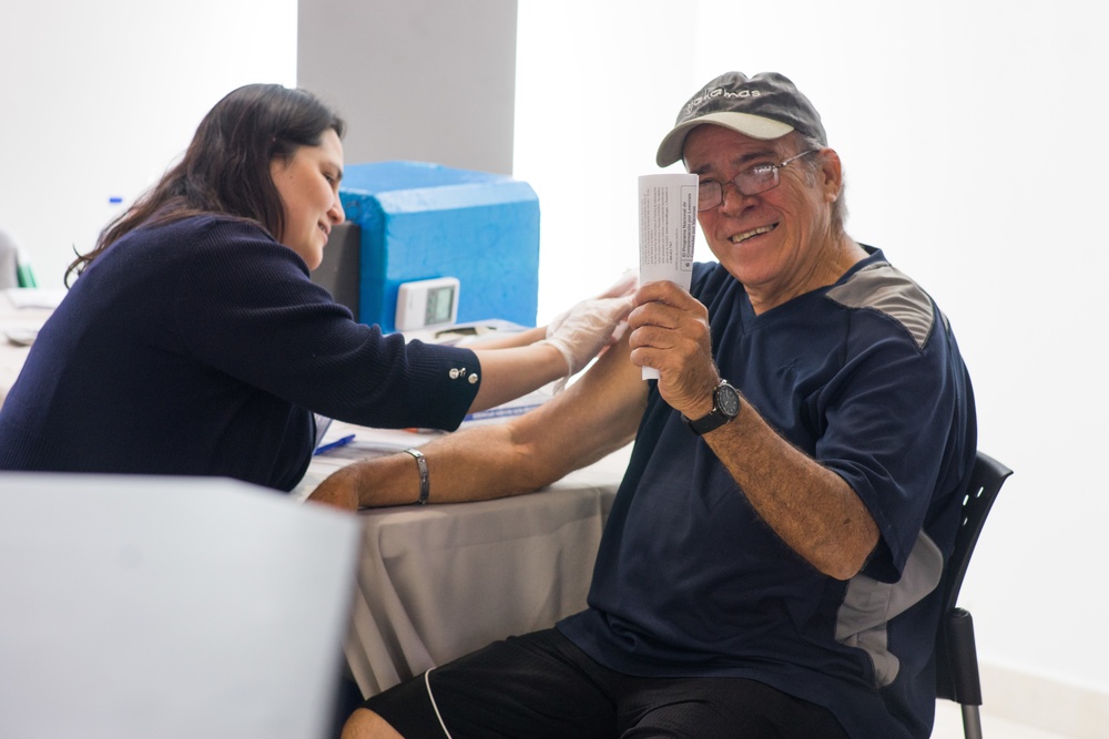 Survivor Gets Flu Shot at Plaza Las Américas Event