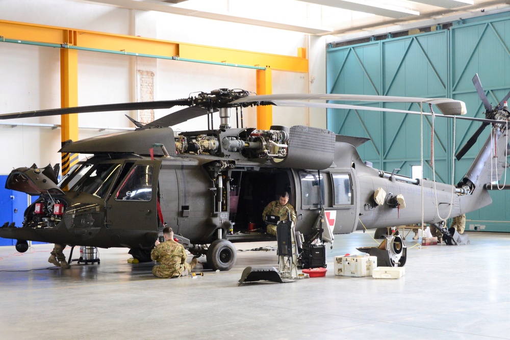 Soldiers at Fort Hood Texas conducts 40-120 flight hours maintenance on a HH-60 MEDEVAC helicopter.