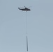 Helicopter Delivers Poles To Re-establish The Power Grid