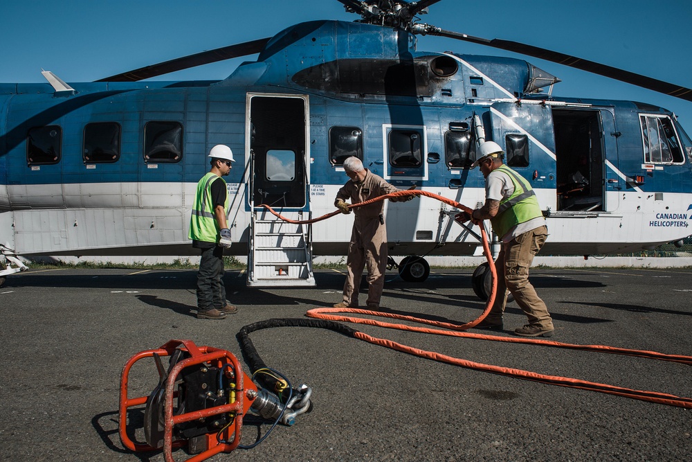 Helicopters Deliver Power Poles In Puerto Rico