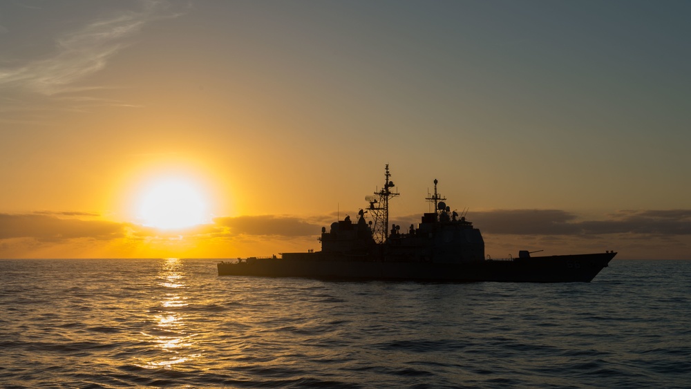 Sunrise over USS Hue City (CG 66)