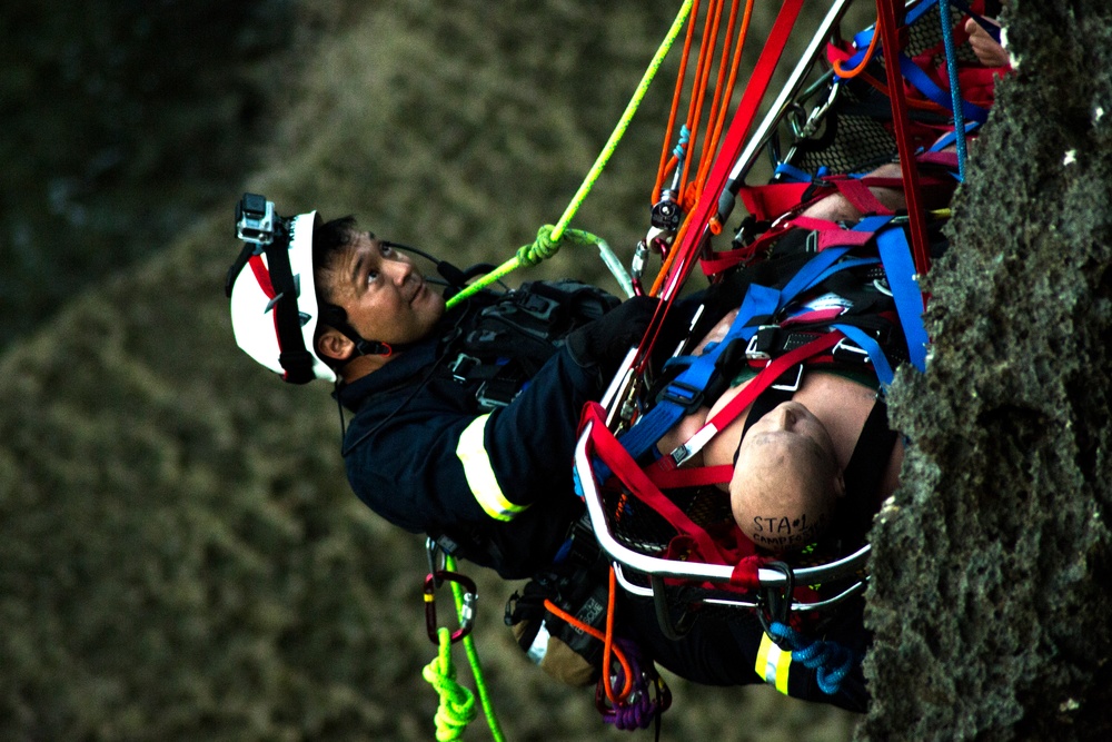 On the Edge: MCIPAC Firemen conduct cliff rescue training
