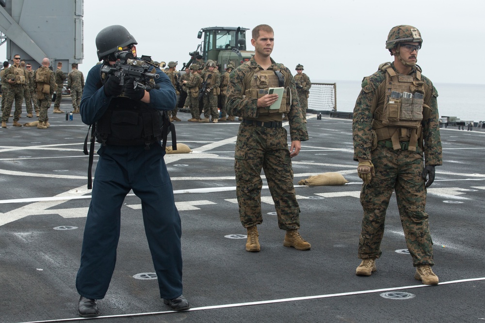 U.S. Marines with BLT 3/1 conduct a live fire deck shoot