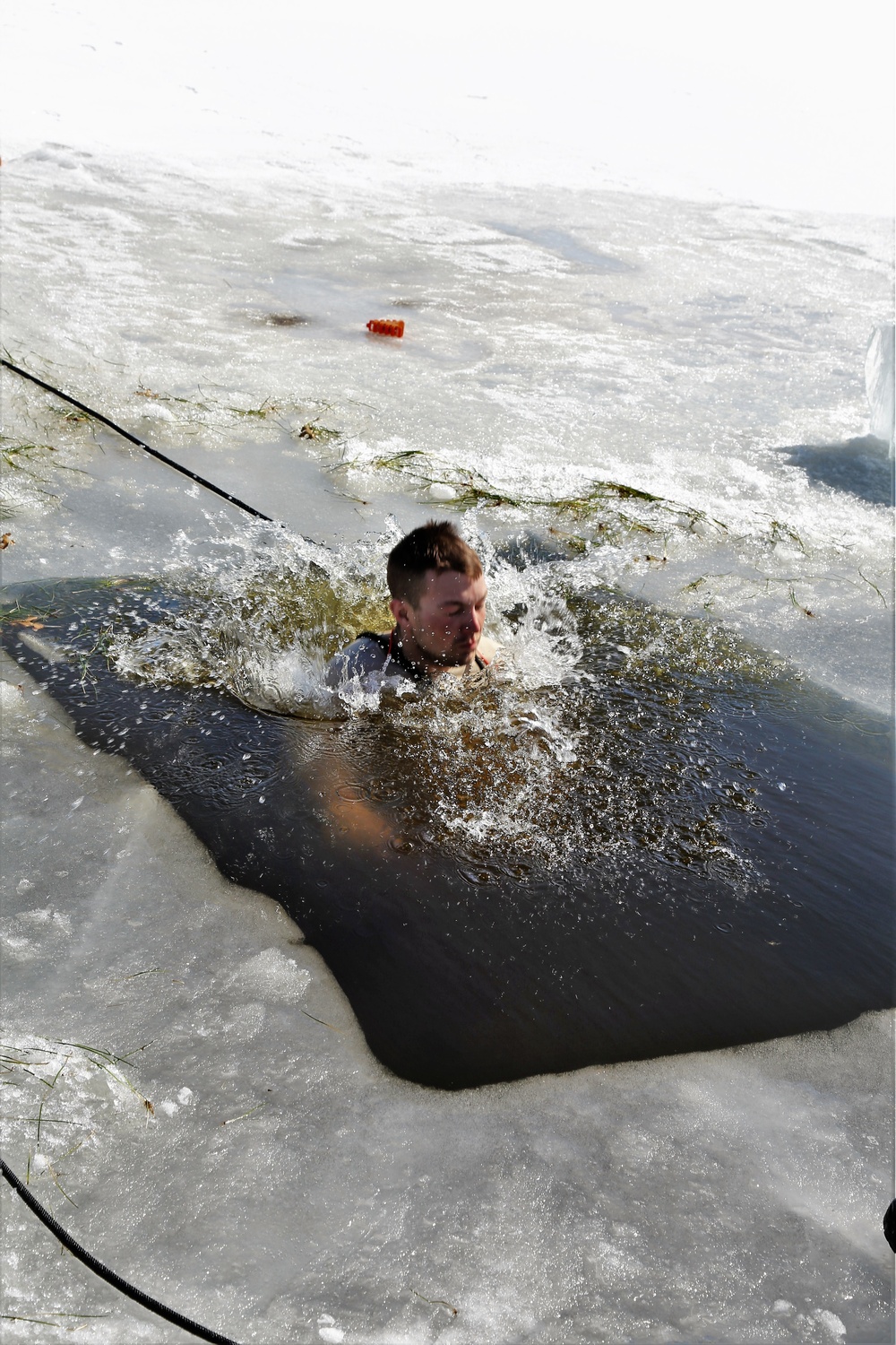 Cold-Weather Operations Course 18-06 students complete cold-water immersion training at Fort McCoy