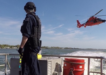 Coast Guard Canine Explosive Detection Team conducts hoist training
