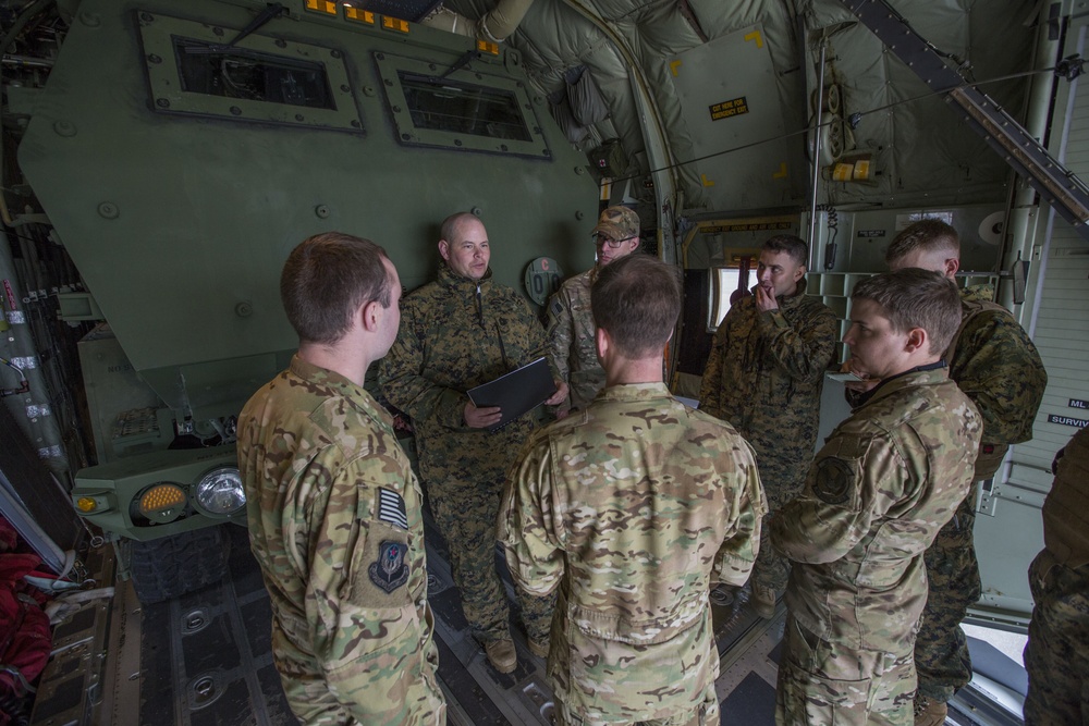 Marines with 2/14 conduct a live-fire HIMARS raid