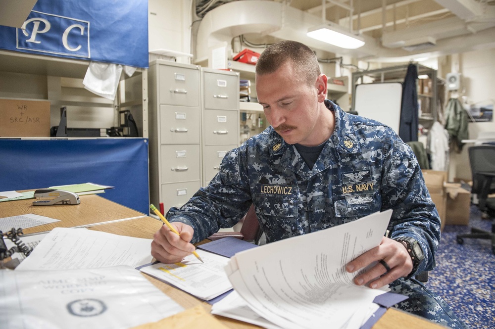 USS America Sailor reviews monthly maintenance plan