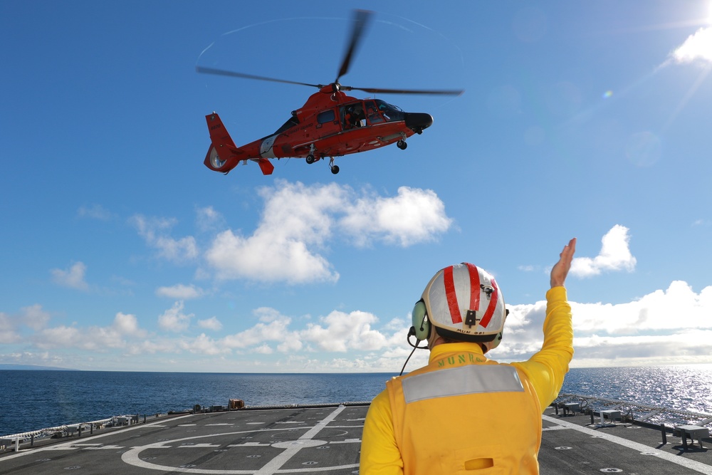 Coast Guard Cutter Munro crewmembers and Air Station San Francisco aircrew conduct vertical replenishment training