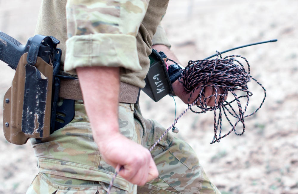 Coalition EOD rigging explosives for disposal