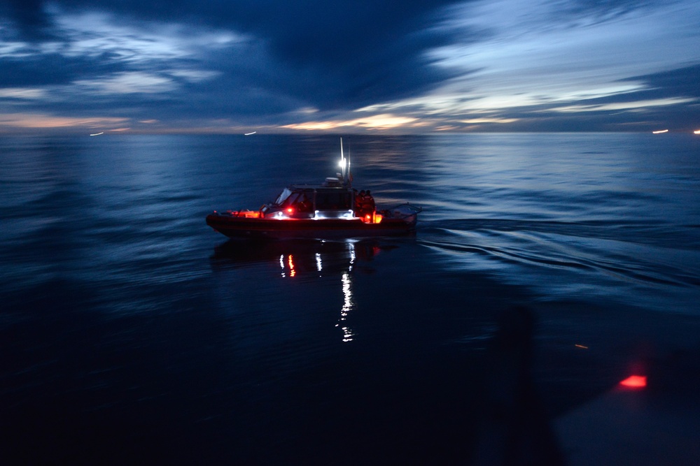 STOCK PHOTO: A Coast Guard Station Humboldt Bay crew aboard a 29-foot Response Boat-Small II pulls up alongside a 47-foot Motor Lifeboat crew to discuss the upcoming evolution prior to completing night-time helicopter operations training near Eureka, Calif., March 6, 2018. Coast Guard helicopter crews routinely conduct training with small boat crews to maintain their qualifications and so that in the event of a medevac request from a boat or ship, the crews are proficient in their lifesaving techniques. (Coast Guard photo by Chief Petty Officer Brandyn Hill)