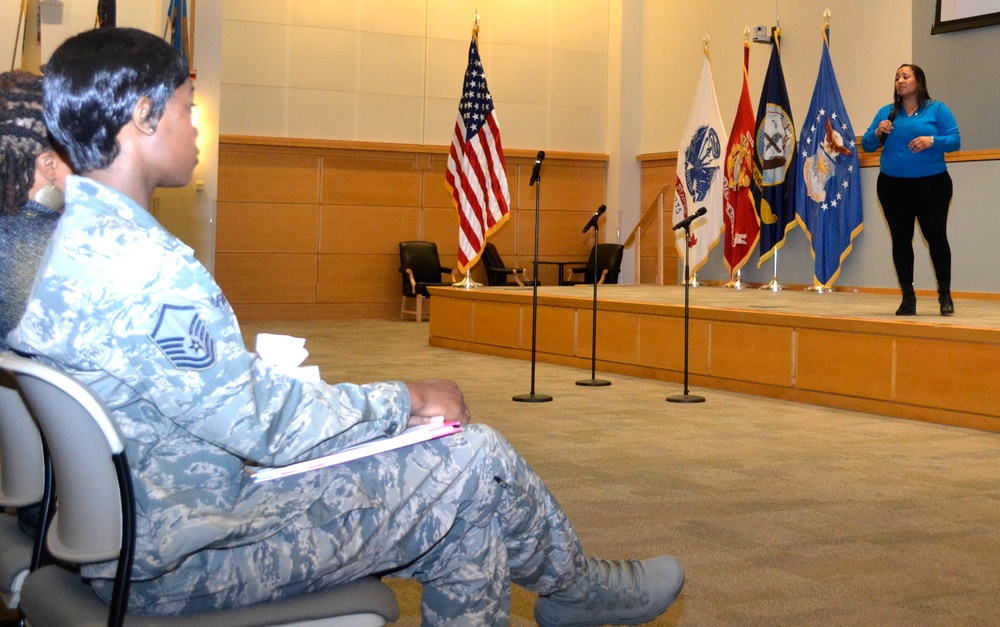 DLA Troop Support’s Air Force Master Sgt. Naka Turner (left) listens as Philadelphia police officer Deborah Grooms shares her story of survival after sexual assault at the &quot;Speak Up, Stand Up&quot; empowerment event April 4 in Philadelphia.