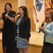 LaTosha Wray, Ella Wynn and Dawn Morgan-Moore sing a rendition of Andra Day's &quot;Stand Up For Something&quot; at DLA Troop Support's &quot;Speak Up, Stand Up&quot; empowerment event April 4 in Philadelphia.