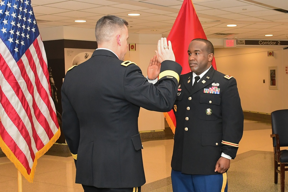 Brig. Gen. Mark Strong host the promotion ceremony of Maj. Linwood Hilton