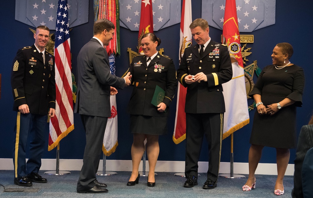 Secretary of the Army Dr. Mark T. Esper presents award to 2018 Army Sexual Assault Response Coordinator of the Year