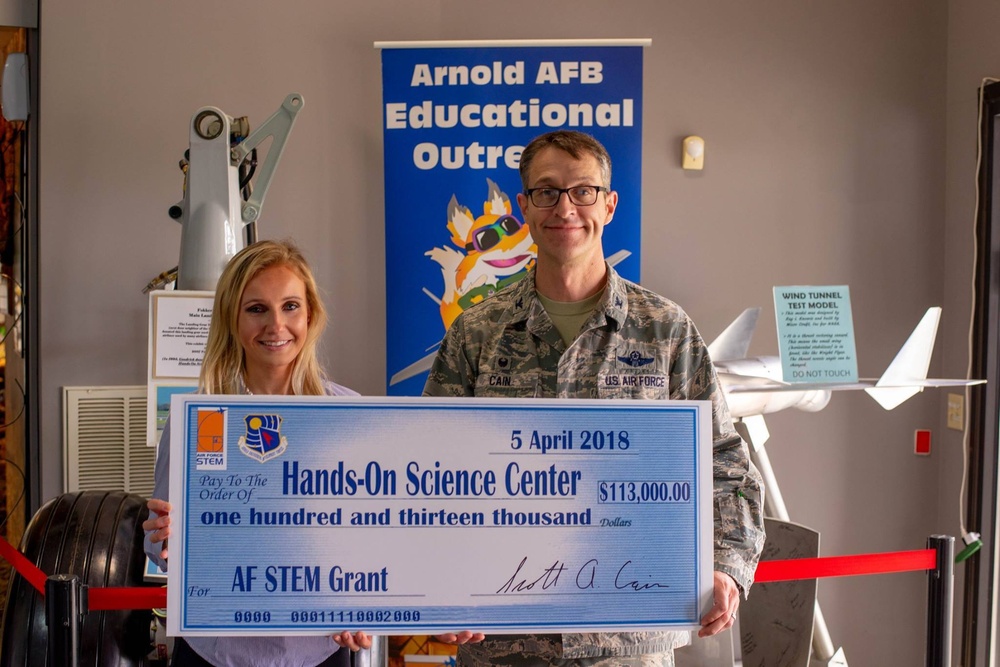 AEDC Commander presents Hands-On Science Center grant check