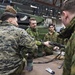 Marines check out Swedish equipment during Winter Sun 18