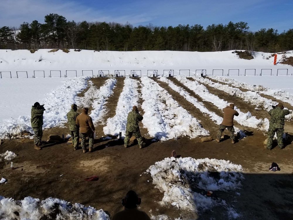 Sailors from Coastal Riverine Squadron 8 Detachment Groton conduct small arms training on an outdoor gun range at Ft. Devens Army Base in Massachusetts