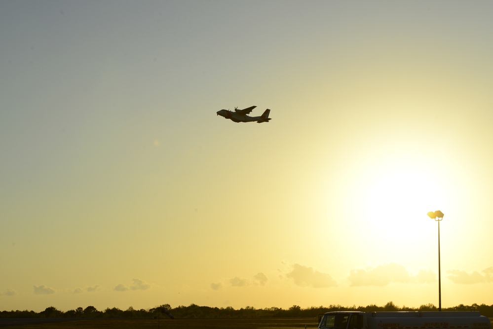 Coast Guard Ocean Sentry flies over training center