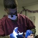 31st MEU dental officer extracts wisdom teeth while underway