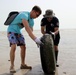 Task Force Spartan Soldiers join embassy staff, concerned citizens in beach cleanup