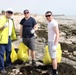 Task Force Spartan Soldiers join embassy staff, concerned citizens in beach cleanup