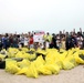 Task Force Spartan Soldiers join embassy staff, concerned citizens in beach cleanup