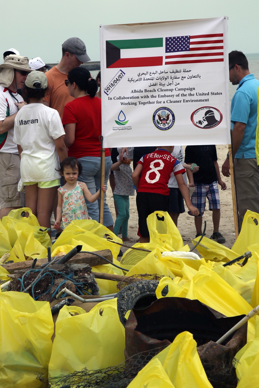 Task Force Spartan Soldiers join embassy staff, concerned citizens in beach cleanup