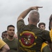 Marines and Sailors PT on the flight deck of the USS Wasp