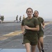 Marines and Sailors PT on the flight deck of the USS Wasp