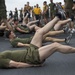 Marines and Sailors PT on the flight deck of the USS Wasp