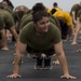 Marines and Sailors PT on the flight deck of the USS Wasp