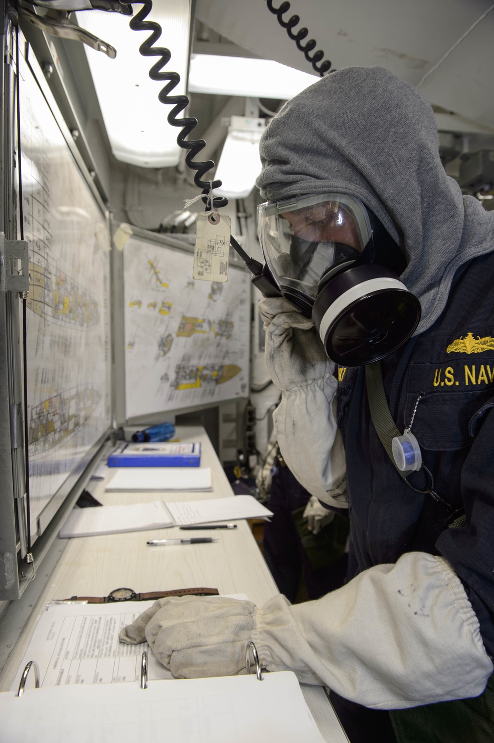 USS Mustin (DDG 89) Sailor participates in Chemical, Biological, Radiological (CBR) general quarters exercise