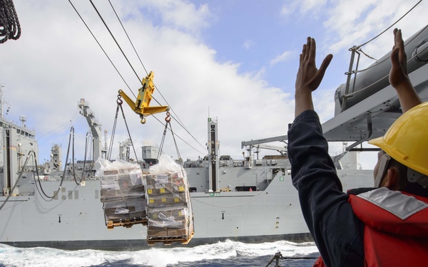 USS Mustin (DDG 89) conducts a replenishment-at-sea with USNS Matthew Perry (T-AKE-9)