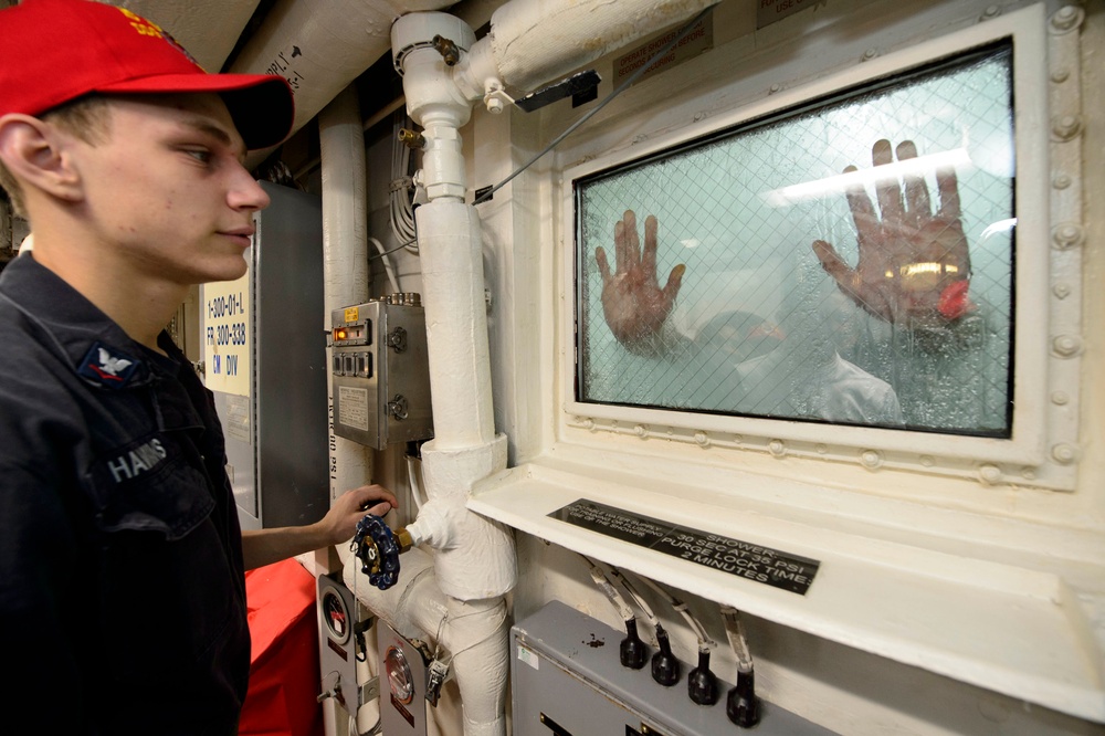 USS Mustin Sailors conduct general quarters Chemical, Biological, Radiological (CBR) exercise