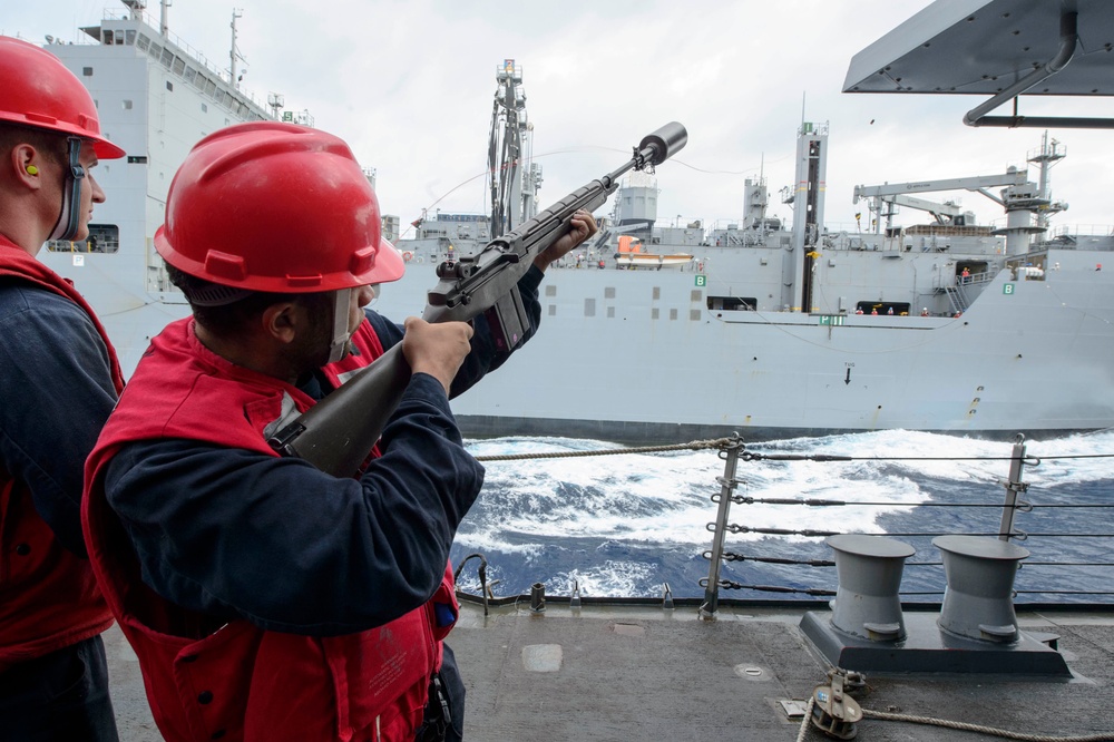 USS Mustin (DDG 89) conducts a replenishment-at-sea with USNS Matthew Perry (T-AKE-9)
