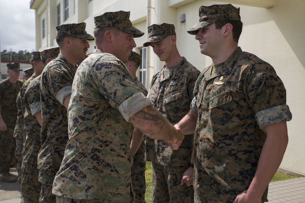 3rd Marine Division Commanding General Maj. Gen. Craig Q. Timberlake presents to coin to 3rd Reconnaissance Battalion Marine