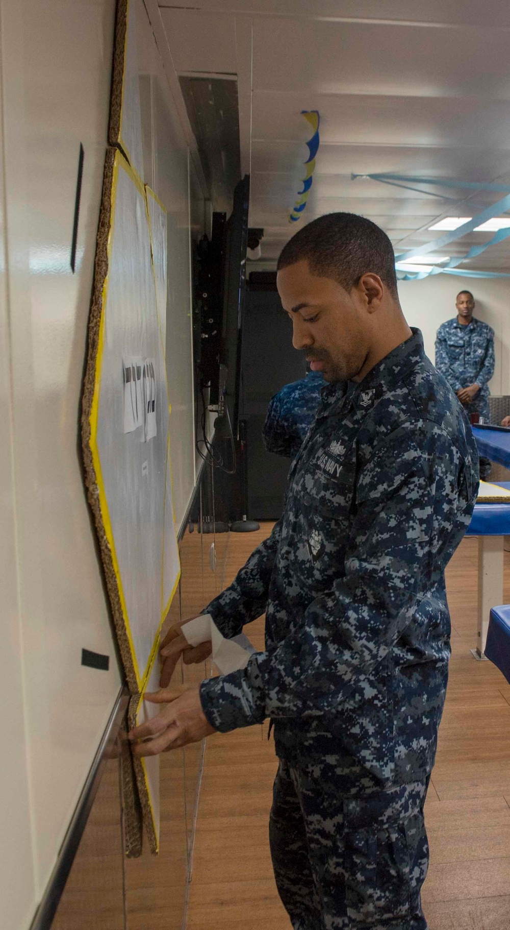 Service members observe diversity committee meeting aboard USNS Mercy