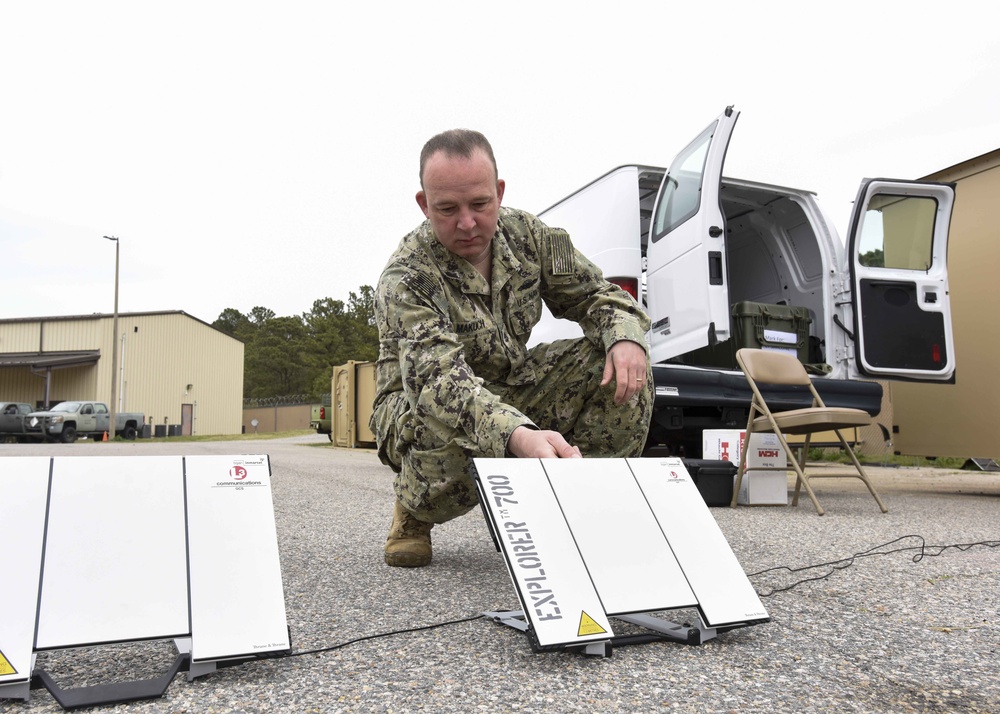 Chief Electronics Technician Phillip Makuch, from Valdosta, Georgia, assigned to Navy Expeditionary Combat Command (NECC), sets up a Navy/Marine Corps Intranet fly-away kit for NECC’s staff exercise,