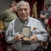 Ben Skardon displays his Congressional Gold Medal