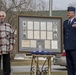 Family is Presented with Framed Documents