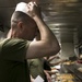 31st MEU’s Sgt. Maj., CO, and Chaplains serve dinner to Marines and Sailors