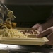 31st MEU’s Sgt. Maj., CO, and Chaplains serve dinner to Marines and Sailors